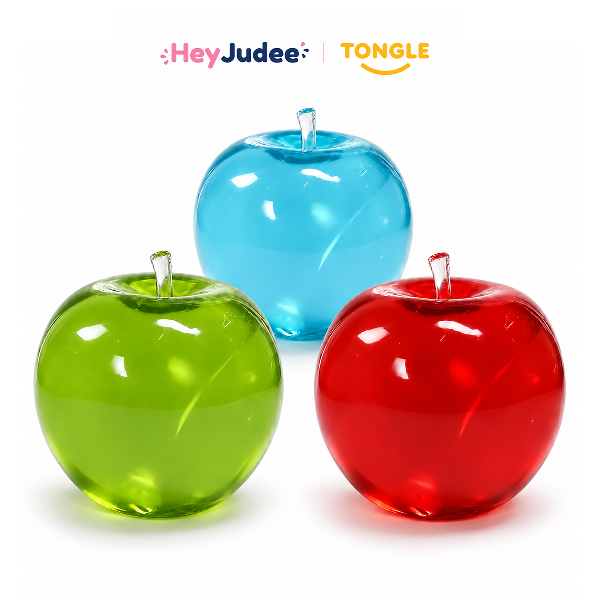 Blue, green and red translucent apple-shaped squishy toys on white background