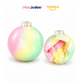 Pastel wax-cracking squishy balls, one shown cracked open, on white background